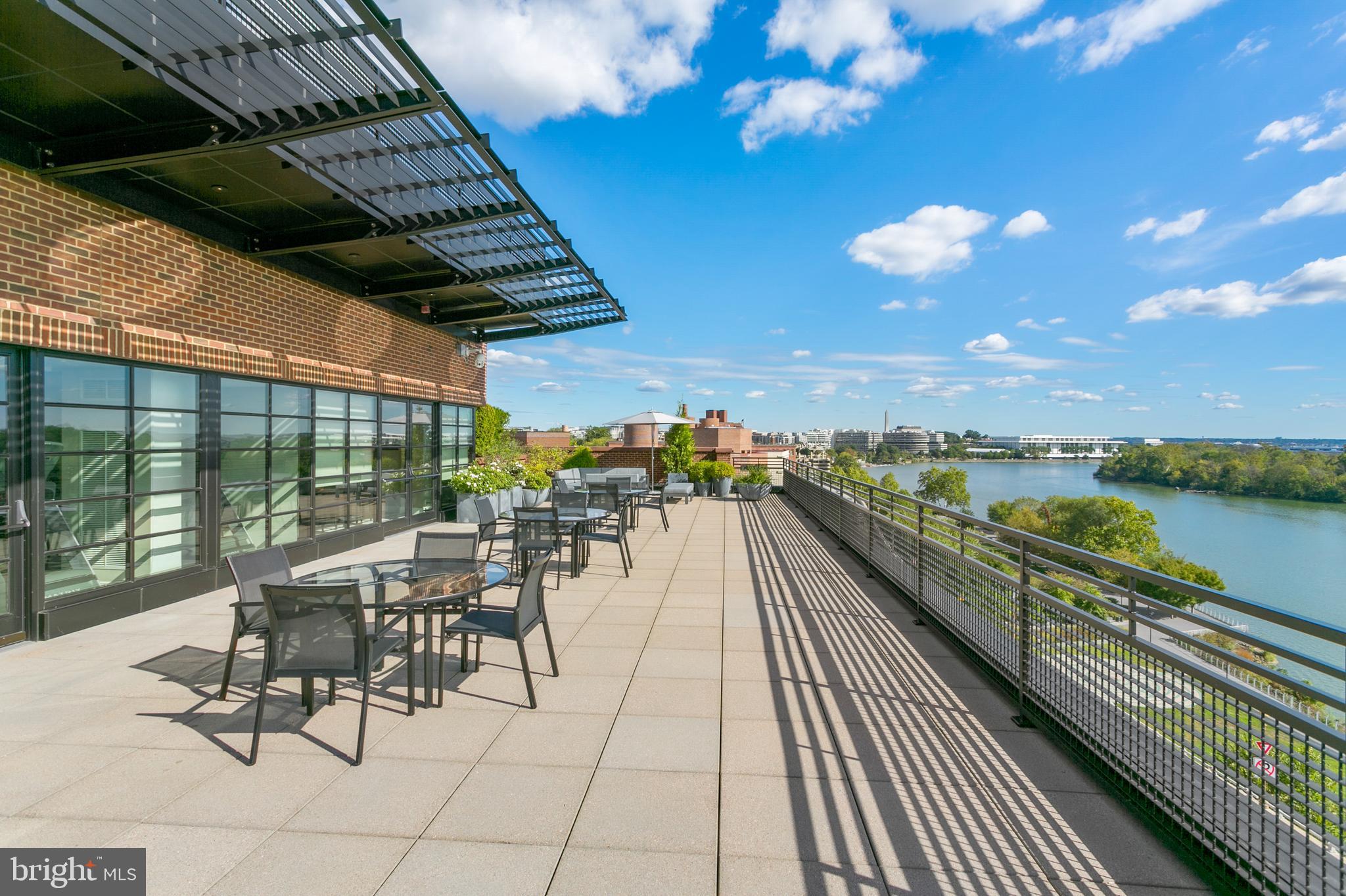 3303 Water Street Northwest, Unit 3B Washington, DC 20007 - Photo 17 of 25 a view of a balcony with chairs