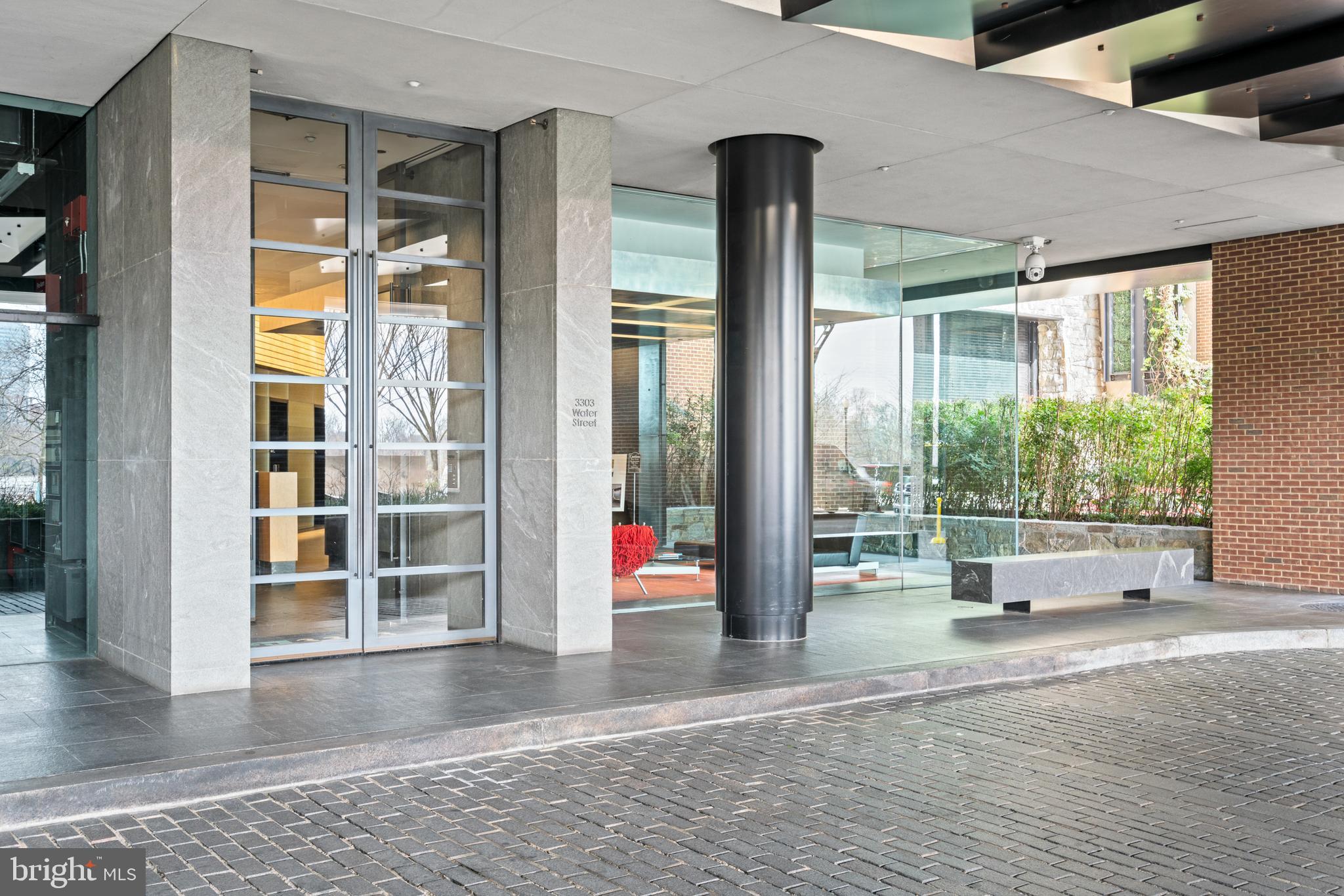 3303 Water Street Northwest, Unit 3B Washington, DC 20007 - Photo 23 of 25 a view of livingroom with floor to ceiling window
