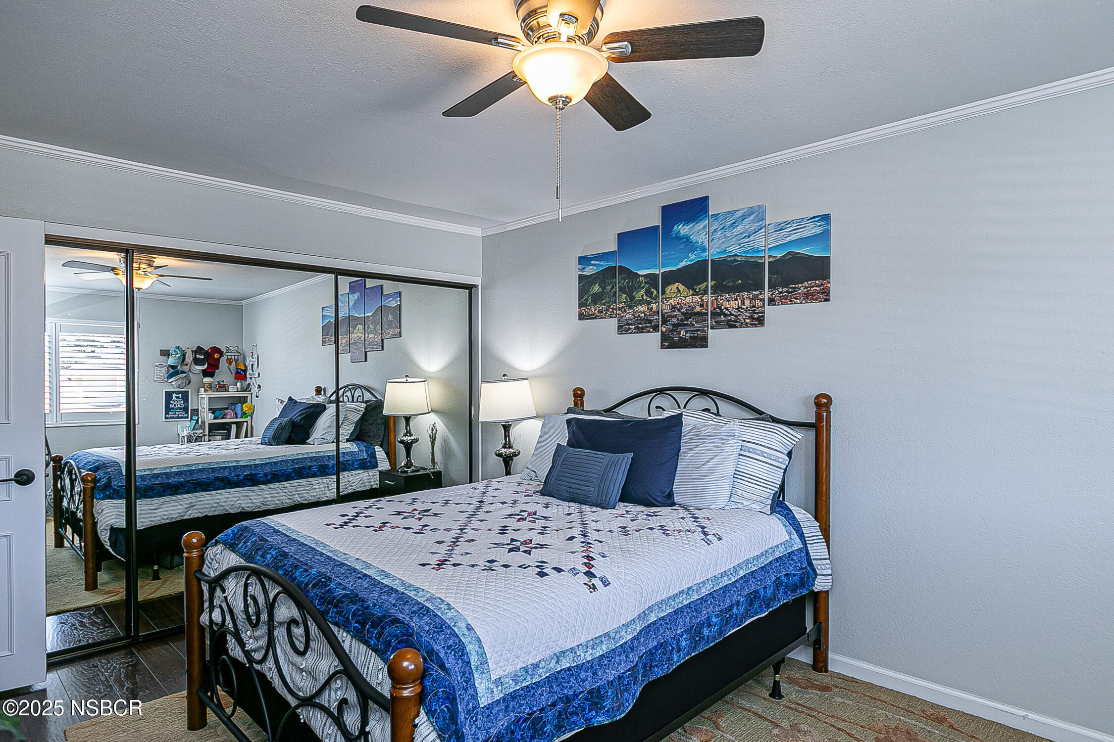 1193 Sumner Place, Unit C Santa Maria, CA 93455 - Photo 13 of 22 a bed sitting in a bedroom next to a window with a chandelier