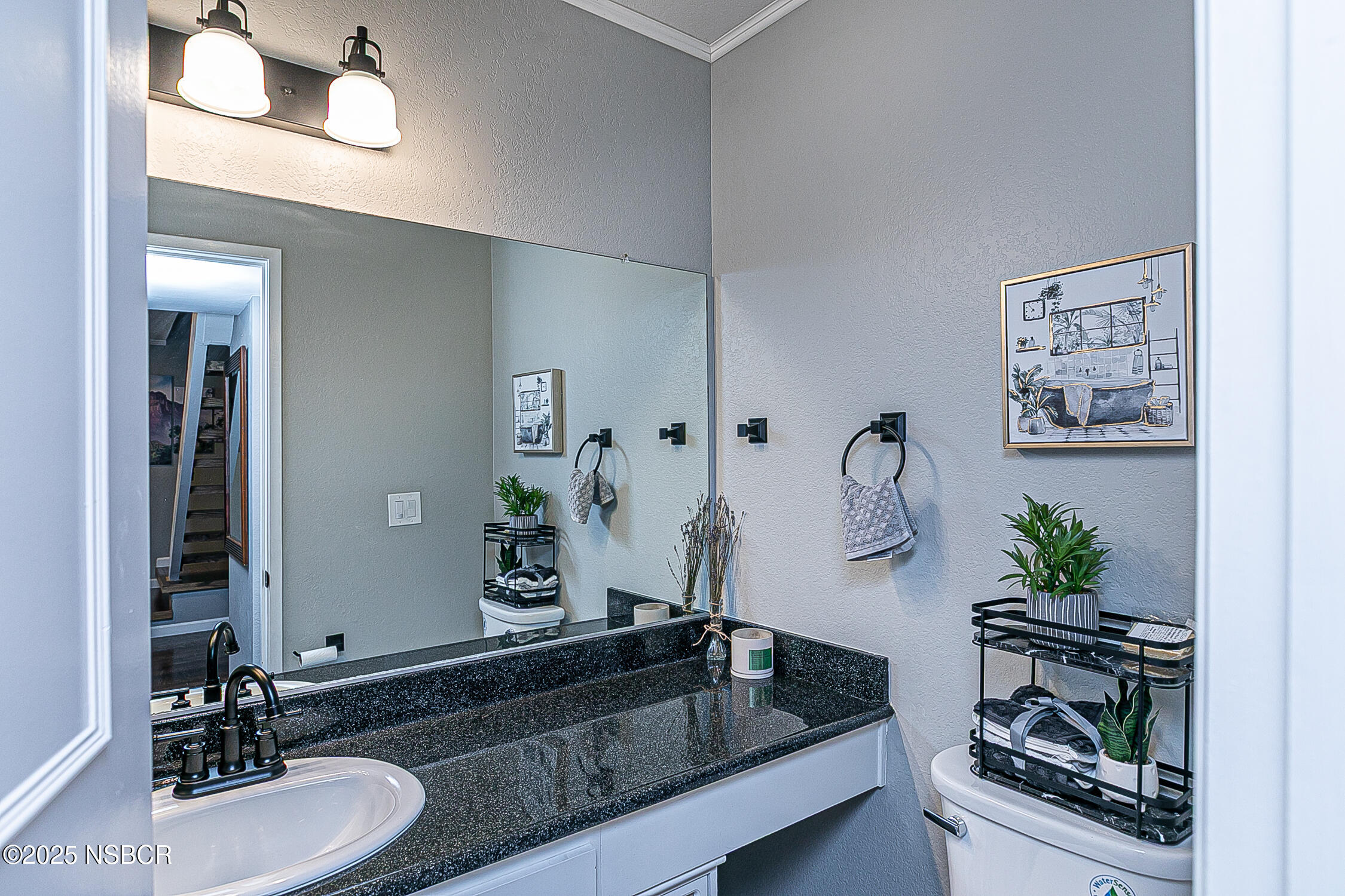 1193 Sumner Place, Unit C Santa Maria, CA 93455 - Photo 19 of 22 a bathroom with a granite countertop sink a potted plant and a mirror