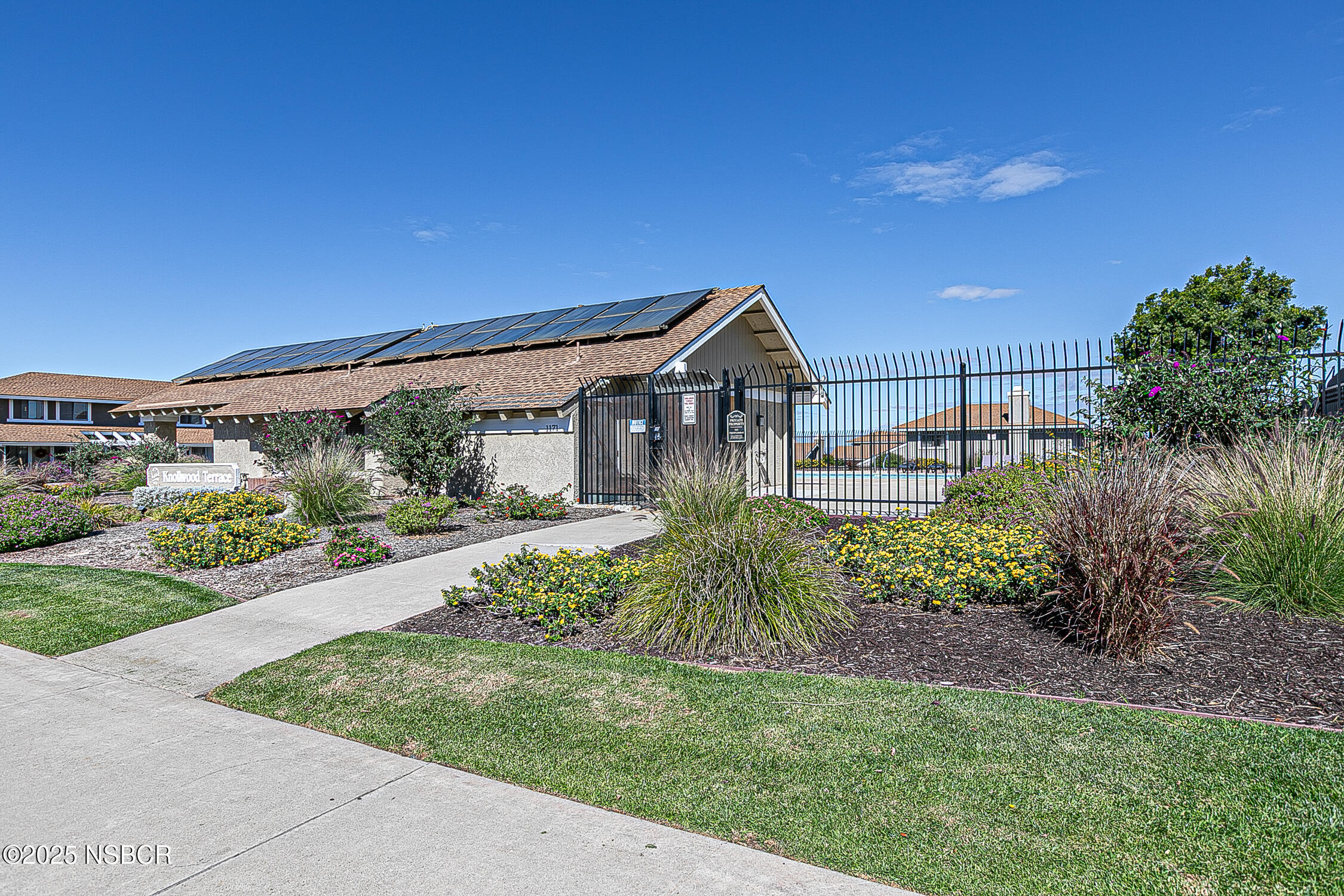 1193 Sumner Place, Unit C Santa Maria, CA 93455 - Photo 21 of 22 a front view of a house with a garden