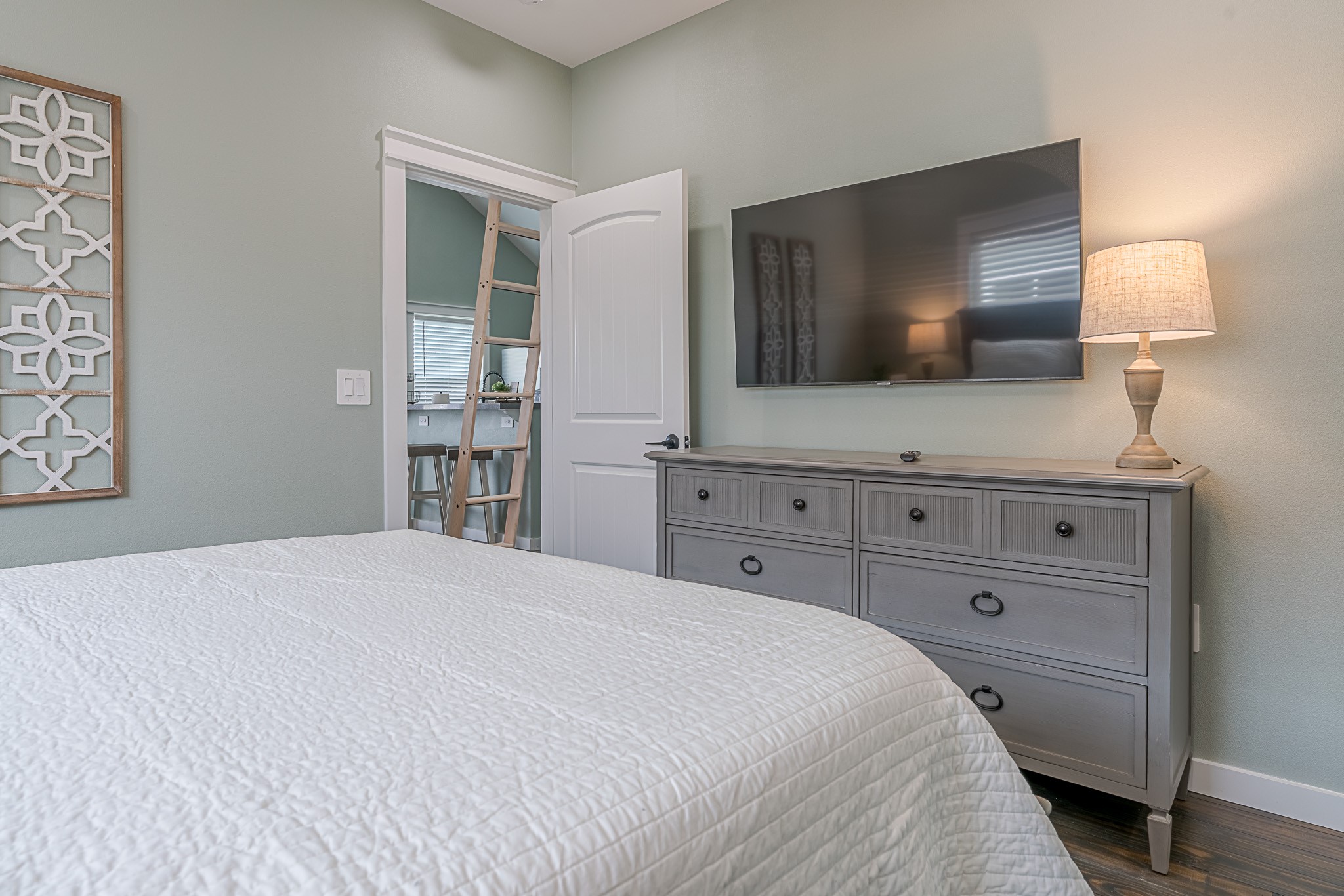 1057 Johnson Road Port Bolivar, TX 77650 - Photo 14 of 40 Wind down in your comfortable bedroom with plenty of room for a large TV and dresser, making quiet nights at home even better.