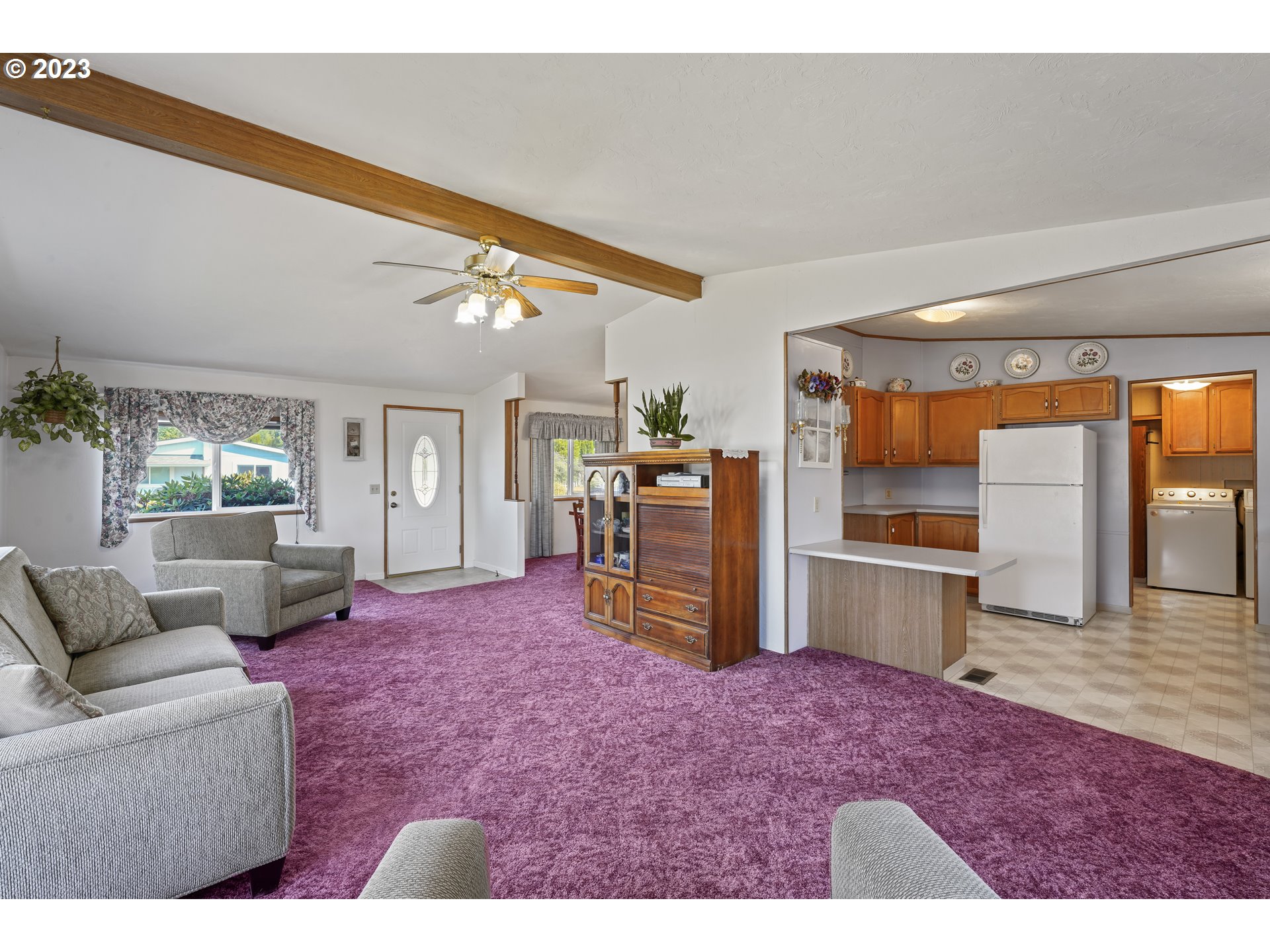 5911 Jessica Lane Springfield, OR 97478 - Photo 8 of 40 a living room with furniture and a kitchen