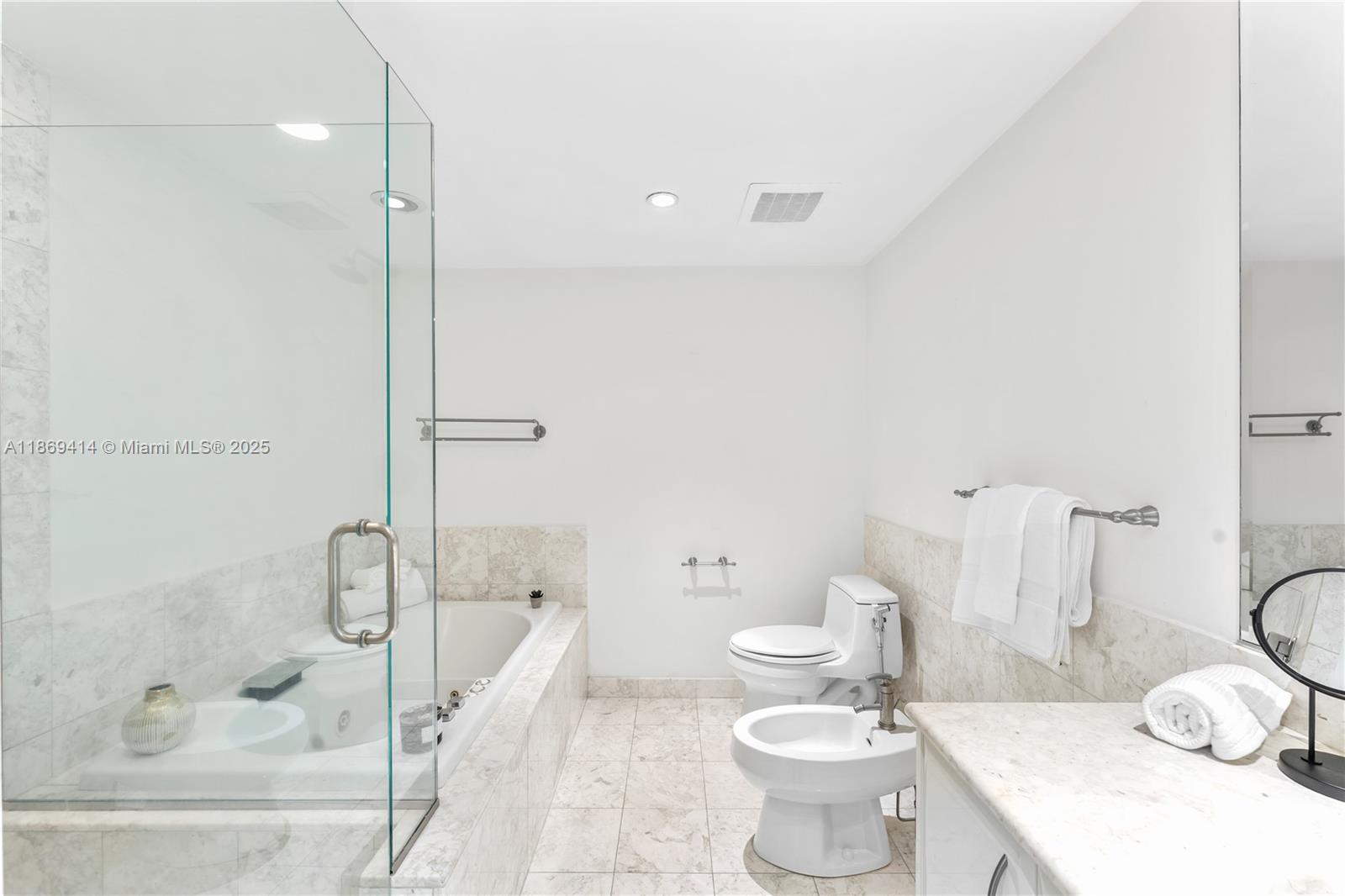 1331 Brickell Bay Drive, Unit 1706 Miami, FL 33131 - Photo 11 of 17 a bathroom with a sink toilet and shower