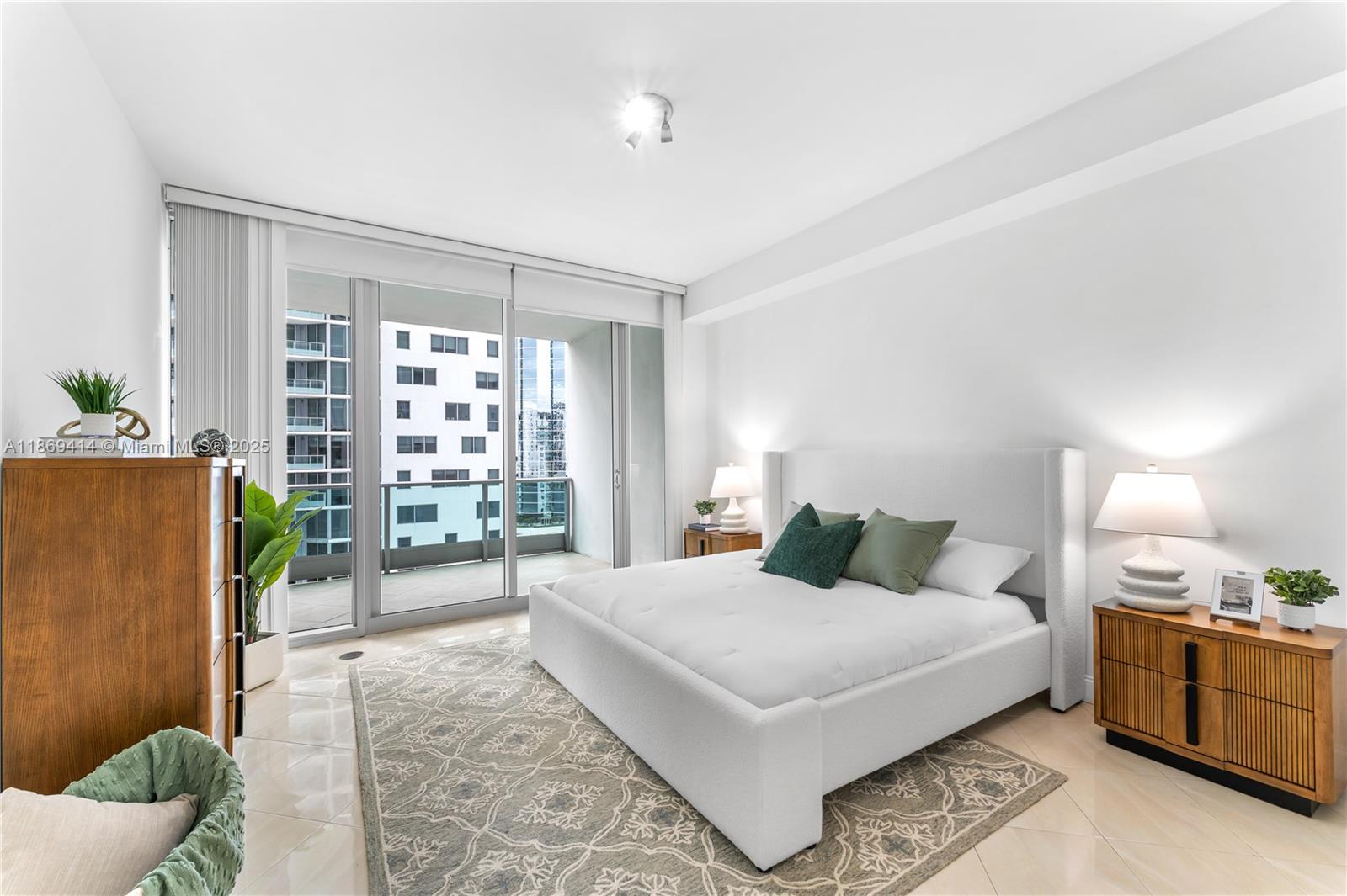 1331 Brickell Bay Drive, Unit 1706 Miami, FL 33131 - Photo 8 of 17 a bedroom with a large bed and a window