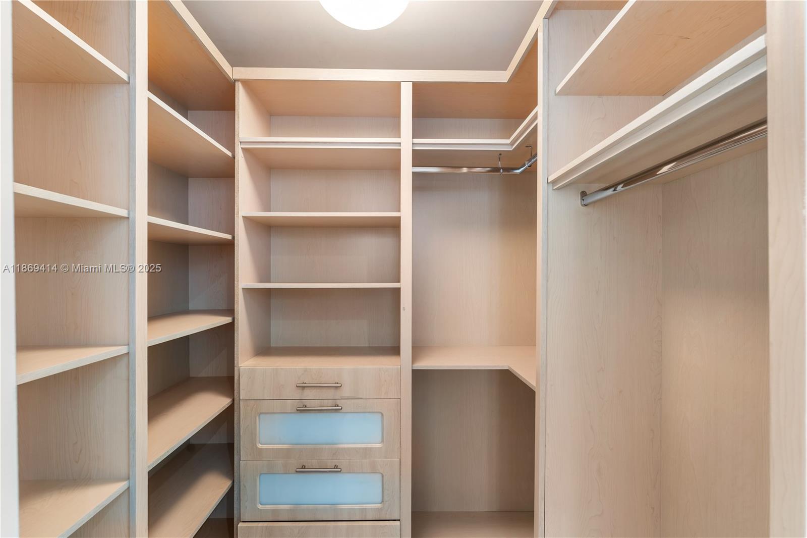 1331 Brickell Bay Drive, Unit 1706 Miami, FL 33131 - Photo 10 of 17 a view of walk in closet with empty racks