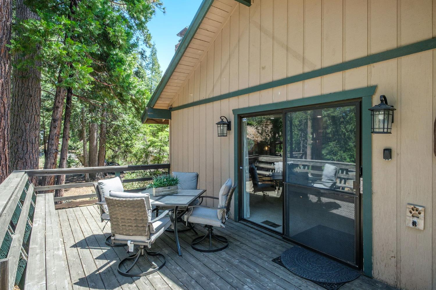 42488 Rock Ledge Road Shaver Lake, CA 93664 - Photo 6 of 26 a view of a two chairs in the balcony