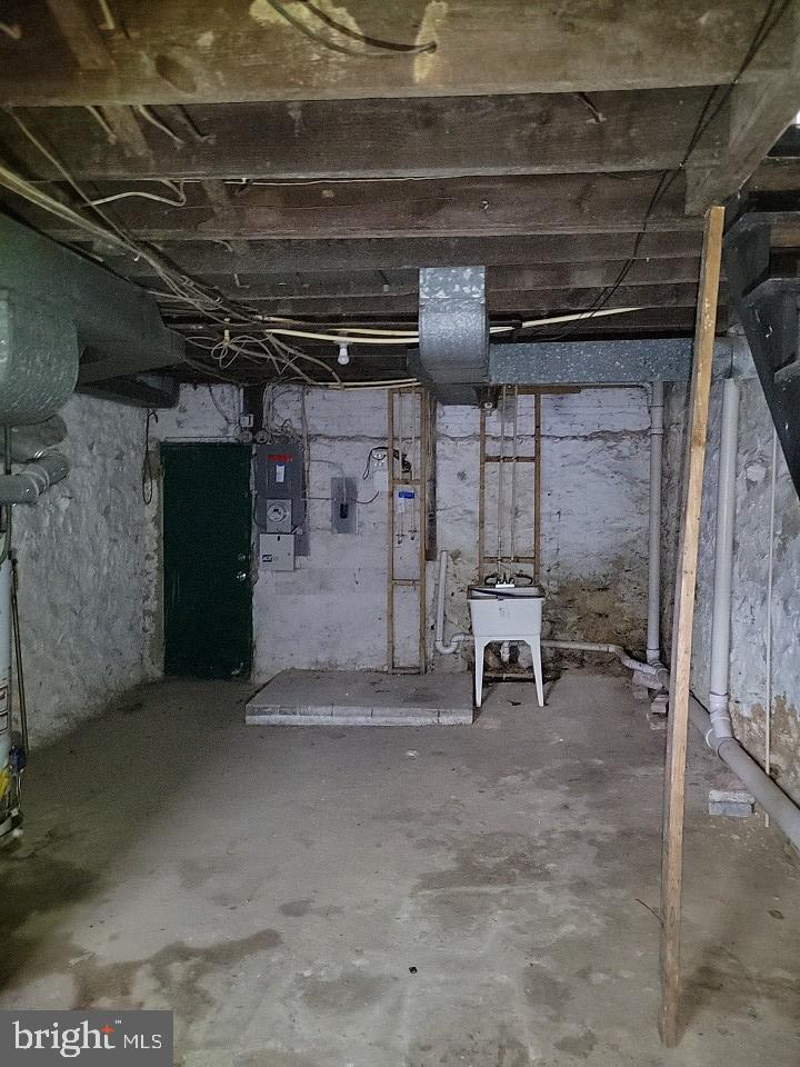 3011 Kenyon Avenue Baltimore, MD 21213 - Photo 13 of 14 a view of a room with wooden shelves