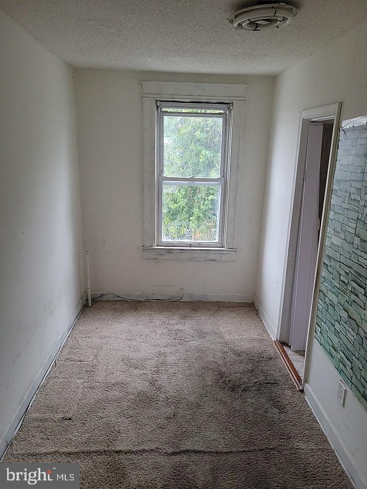 3011 Kenyon Avenue Baltimore, MD 21213 - Photo 9 of 14 an empty room with a window