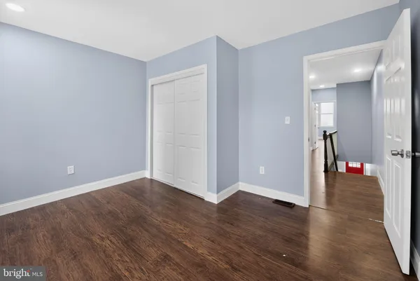 a view of a livingroom with wooden floor