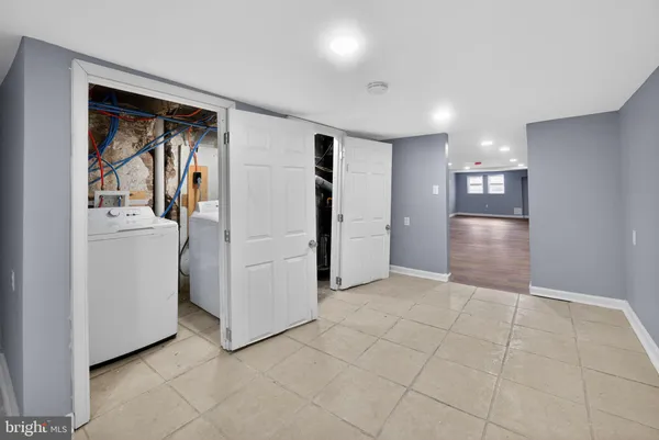 a view of a storage & utility room with closet