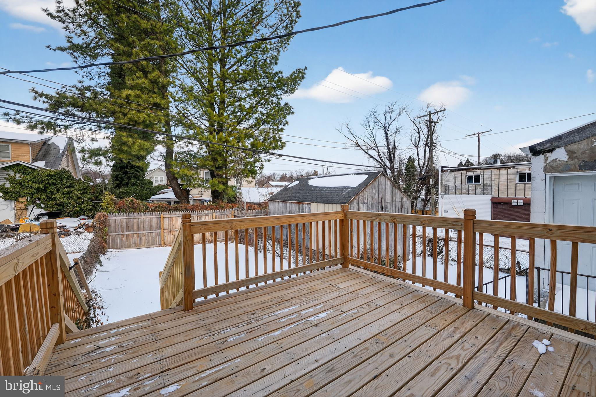 5018 Belair Road Baltimore, MD 21206 - Photo 31 of 32 a view of balcony with wooden floor and fence