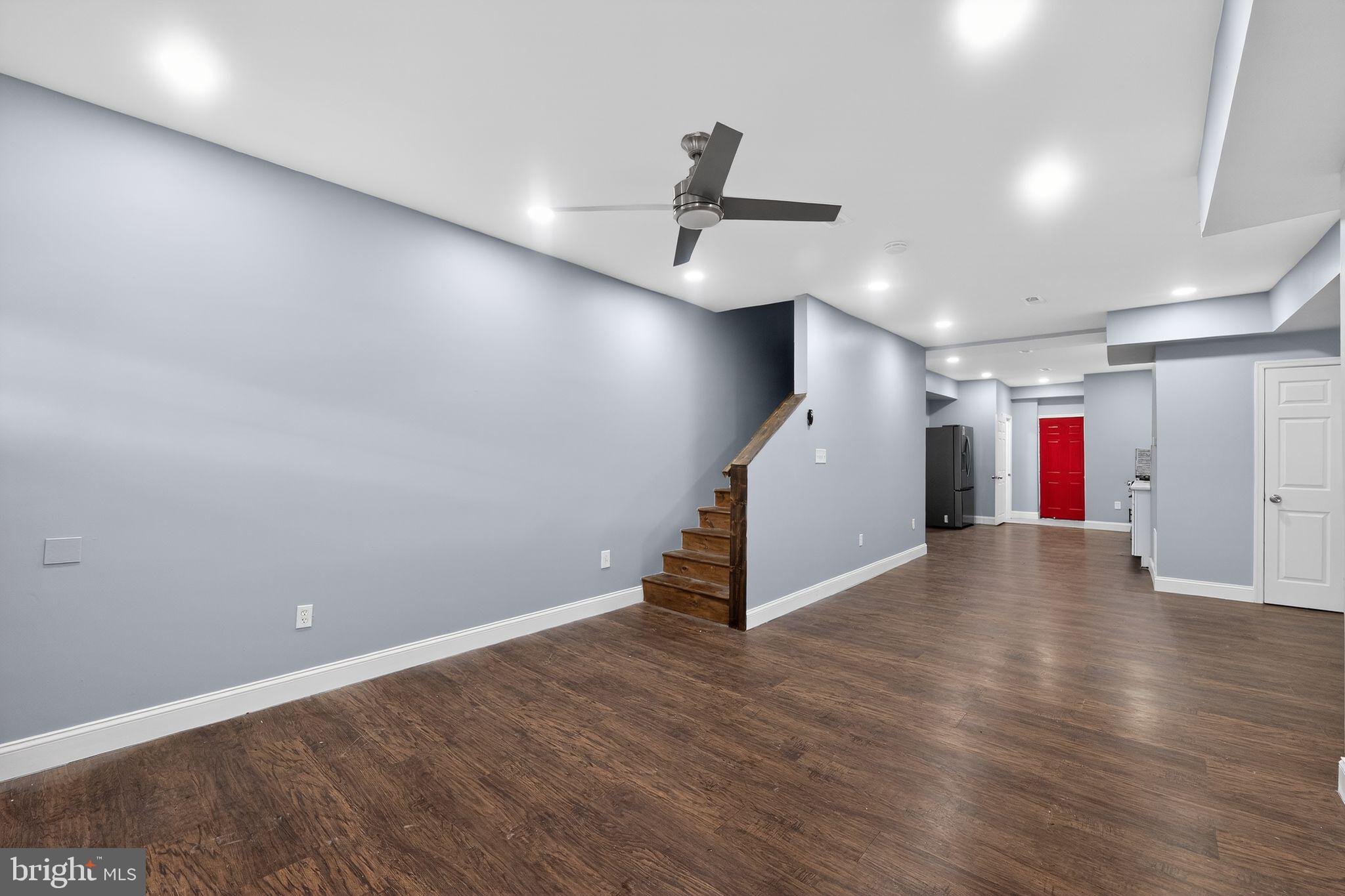 5018 Belair Road Baltimore, MD 21206 - Photo 8 of 32 a view of an empty room with wooden floor