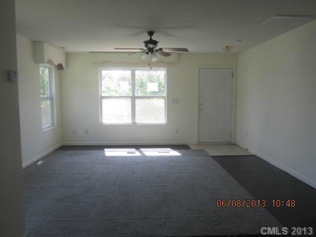 10 Riverside Street Lowell, NC 28098 - Photo 6 of 10 a view of an empty room with a window