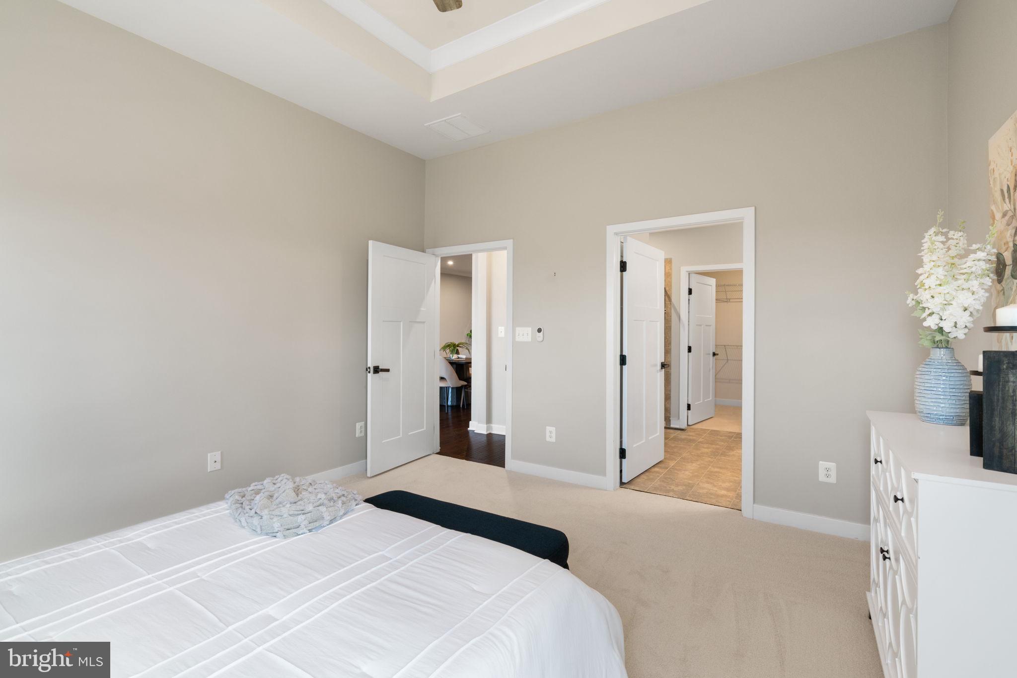 18180 Red Mulberry Road Dumfries, VA 22026 - Photo 19 of 87 a bedroom with a bed and a table