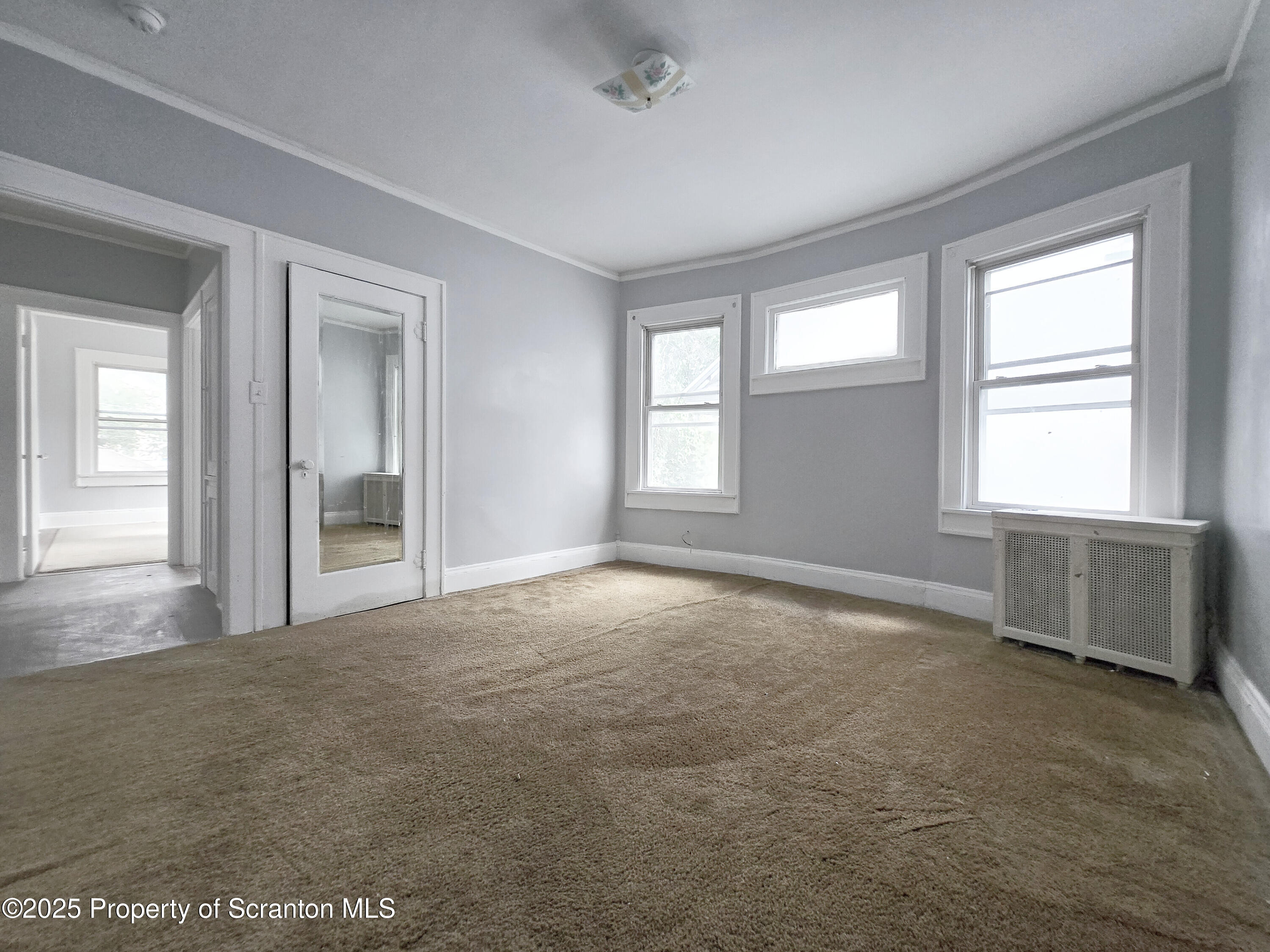 542 Colfax Avenue, Unit 2 Scranton, PA 18510 - Photo 11 of 15 an empty room with windows
