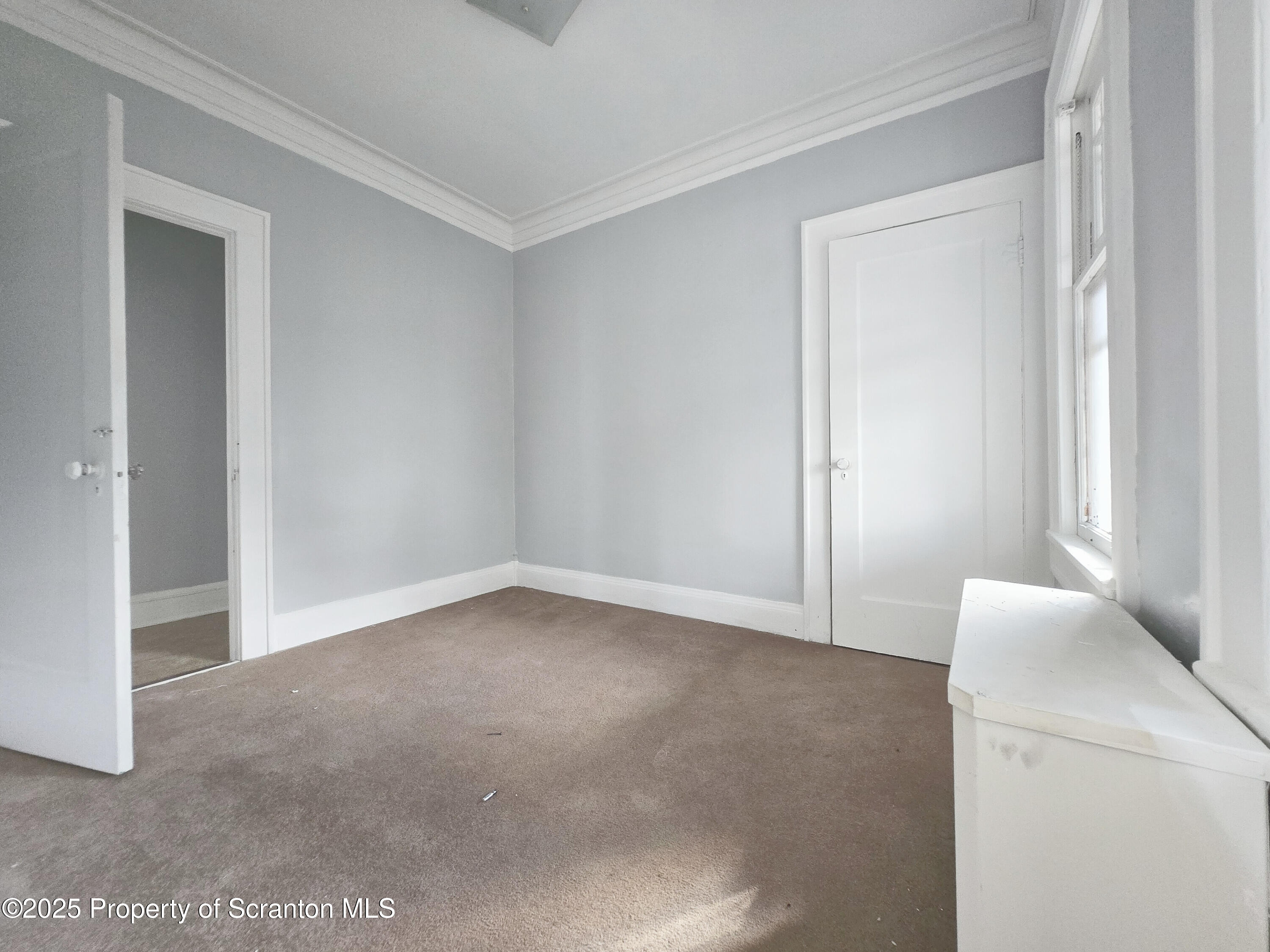542 Colfax Avenue, Unit 2 Scranton, PA 18510 - Photo 12 of 15 a view of an empty room and window