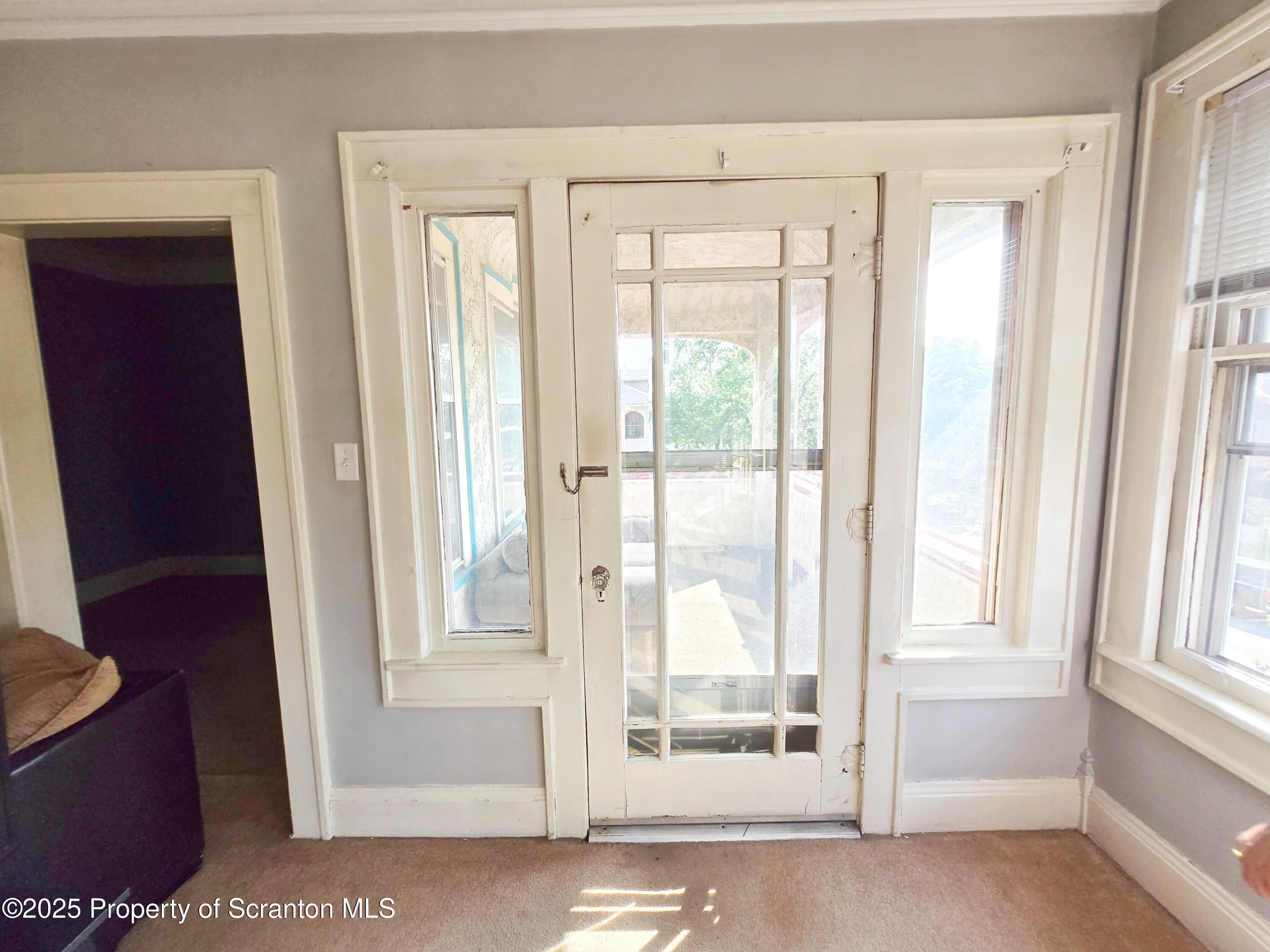 542 Colfax Avenue, Unit 2 Scranton, PA 18510 - Photo 4 of 15 a view of a bathroom with a glass door and a window