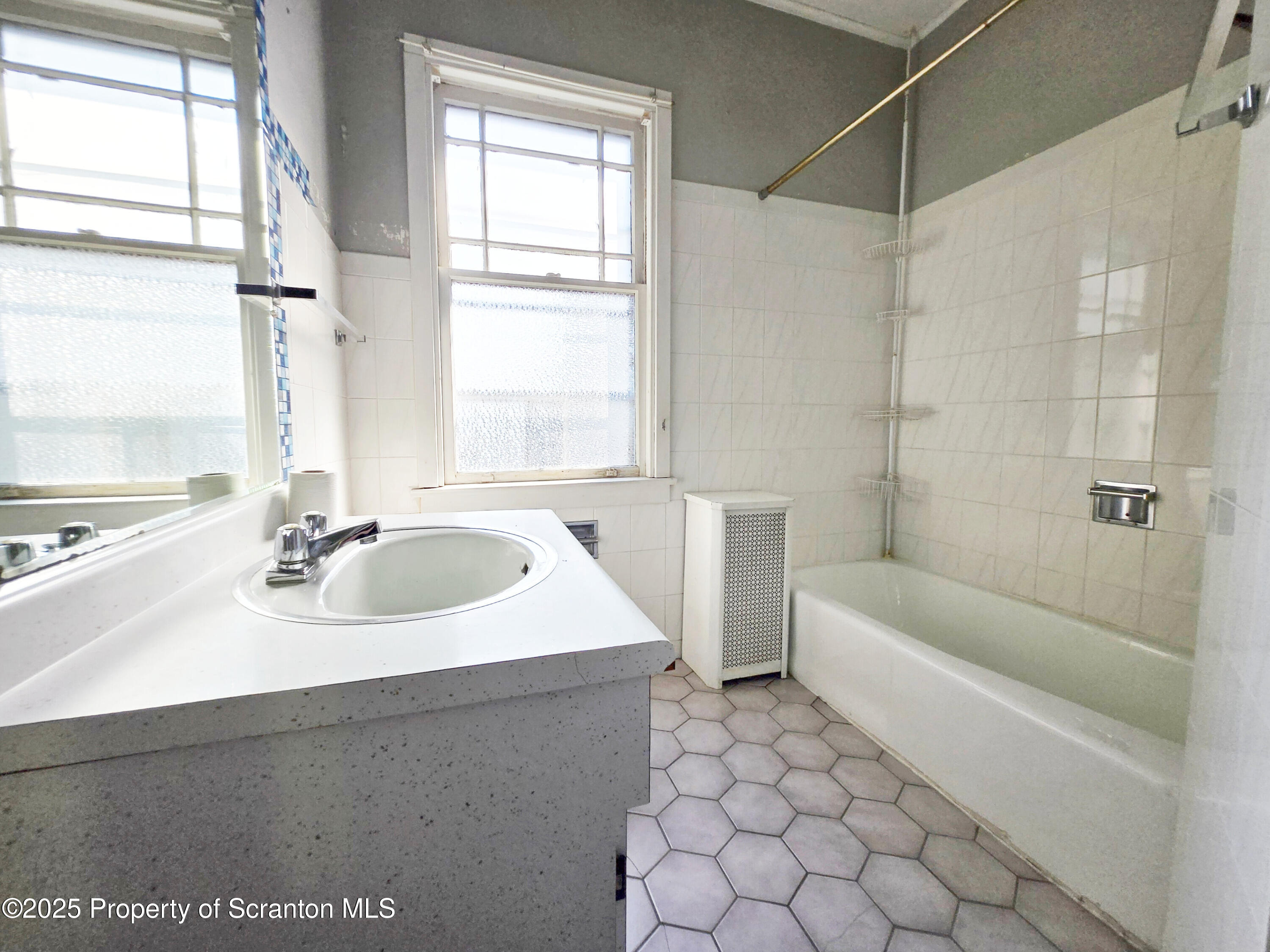 542 Colfax Avenue, Unit 2 Scranton, PA 18510 - Photo 7 of 15 a bathroom with a bathtub and a sink