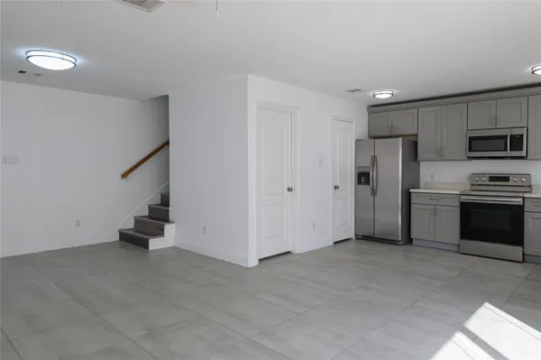 a view of kitchen with cabinets and stainless steel appliances