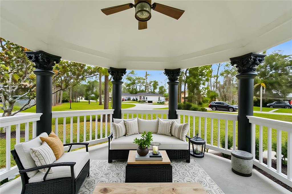 14728 Henson Road Orlando, FL 32832 - Photo 69 of 79 a living room with patio furniture and a floor to ceiling window