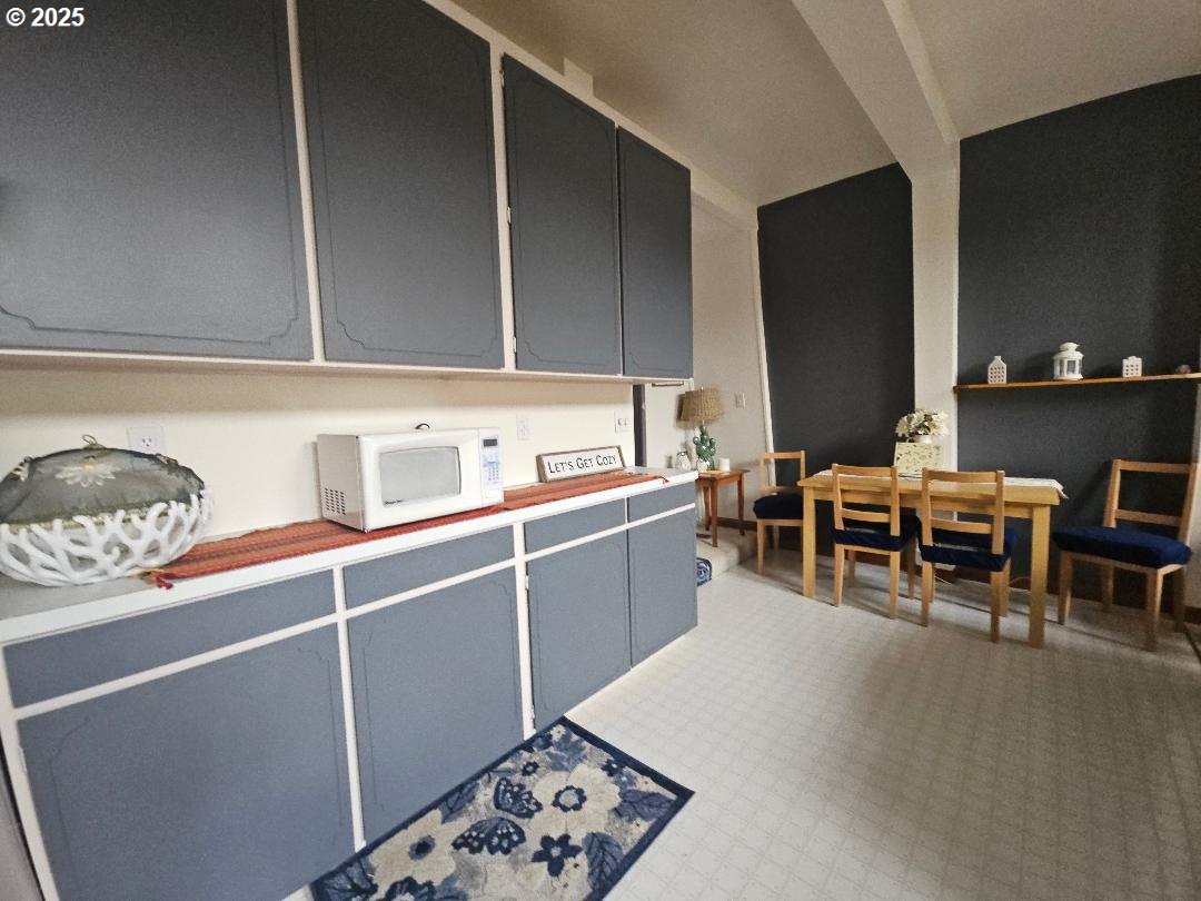 73 South Lakewood Road Tygh Valley, OR 97063 - Photo 21 of 44 a kitchen with a sink dining table and chairs