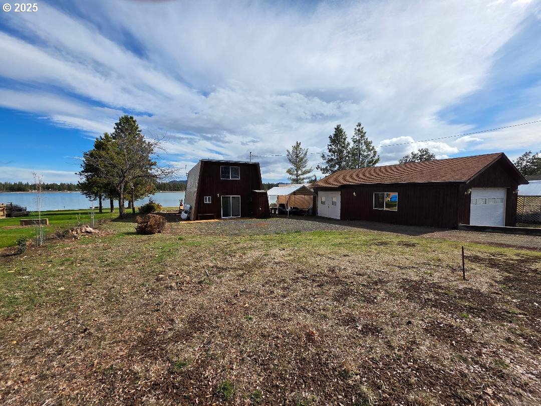 73 South Lakewood Road Tygh Valley, OR 97063 - Photo 39 of 44 a view of a house with a yard and a large tree