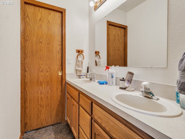 6593 Rippling Brook Drive Southeast Salem, OR 97317 - Photo 12 of 48 a bathroom with a sink and a mirror