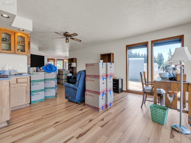 6593 Rippling Brook Drive Southeast Salem, OR 97317 - Photo 16 of 48 a living room with furniture and a wooden floor