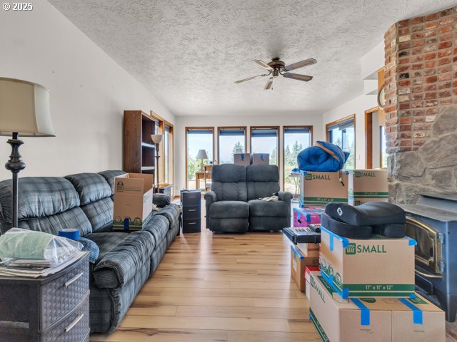 6593 Rippling Brook Drive Southeast Salem, OR 97317 - Photo 17 of 48 a living room with furniture and a fireplace