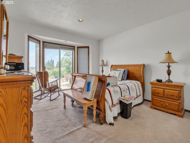 6593 Rippling Brook Drive Southeast Salem, OR 97317 - Photo 18 of 48 a bedroom with furniture and a window