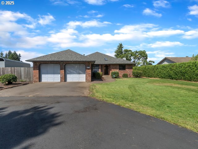 6593 Rippling Brook Drive Southeast Salem, OR 97317 - Photo 2 of 48 a front view of a house with garden