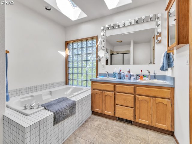 6593 Rippling Brook Drive Southeast Salem, OR 97317 - Photo 22 of 48 a spacious bathroom with a granite countertop double vanity sink mirror and