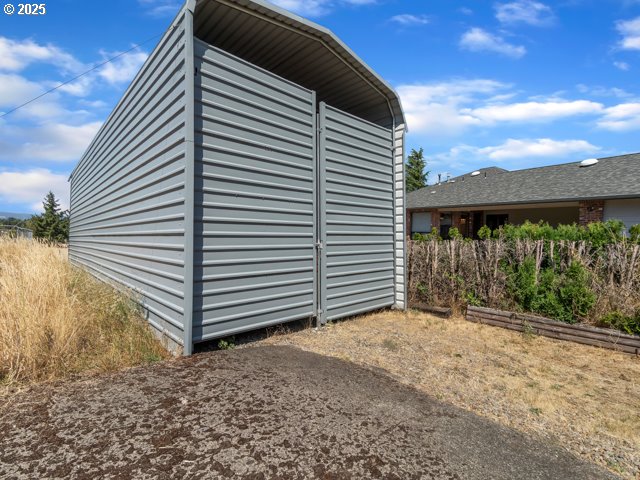 6593 Rippling Brook Drive Southeast Salem, OR 97317 - Photo 28 of 48 a view of a house with a yard and wooden fence