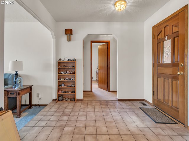6593 Rippling Brook Drive Southeast Salem, OR 97317 - Photo 3 of 48 a view of room with cabinets and wooden floor