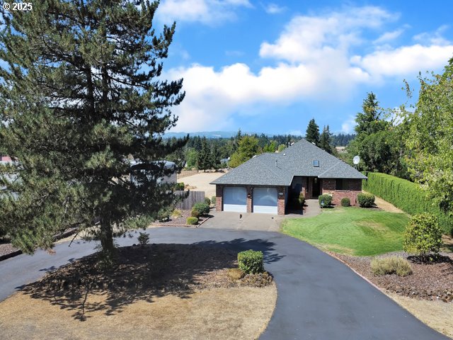 6593 Rippling Brook Drive Southeast Salem, OR 97317 - Photo 46 of 48 a view of a house with a yard