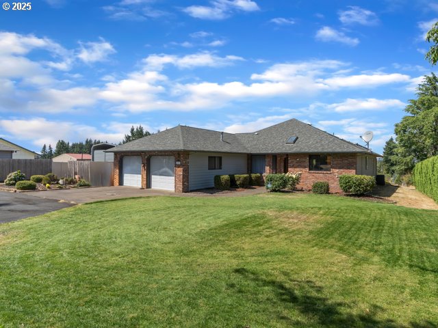 6593 Rippling Brook Drive Southeast Salem, OR 97317 - Photo 47 of 48 a front view of a house with a garden and yard