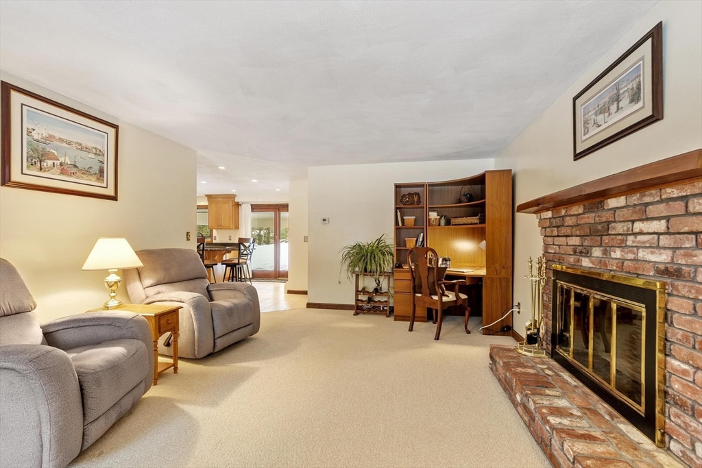53 Throne Hill Road Groton, MA 01450 - Photo 14 of 38 a living room with furniture and a fireplace