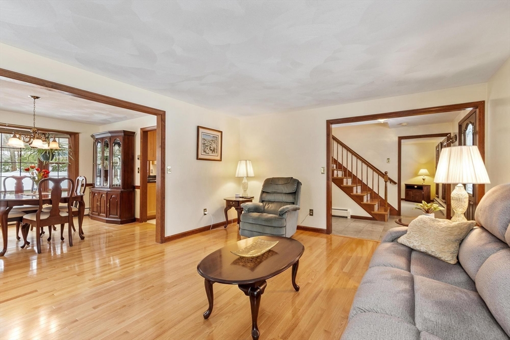 53 Throne Hill Road Groton, MA 01450 - Photo 17 of 38 a living room with furniture and a wooden floor