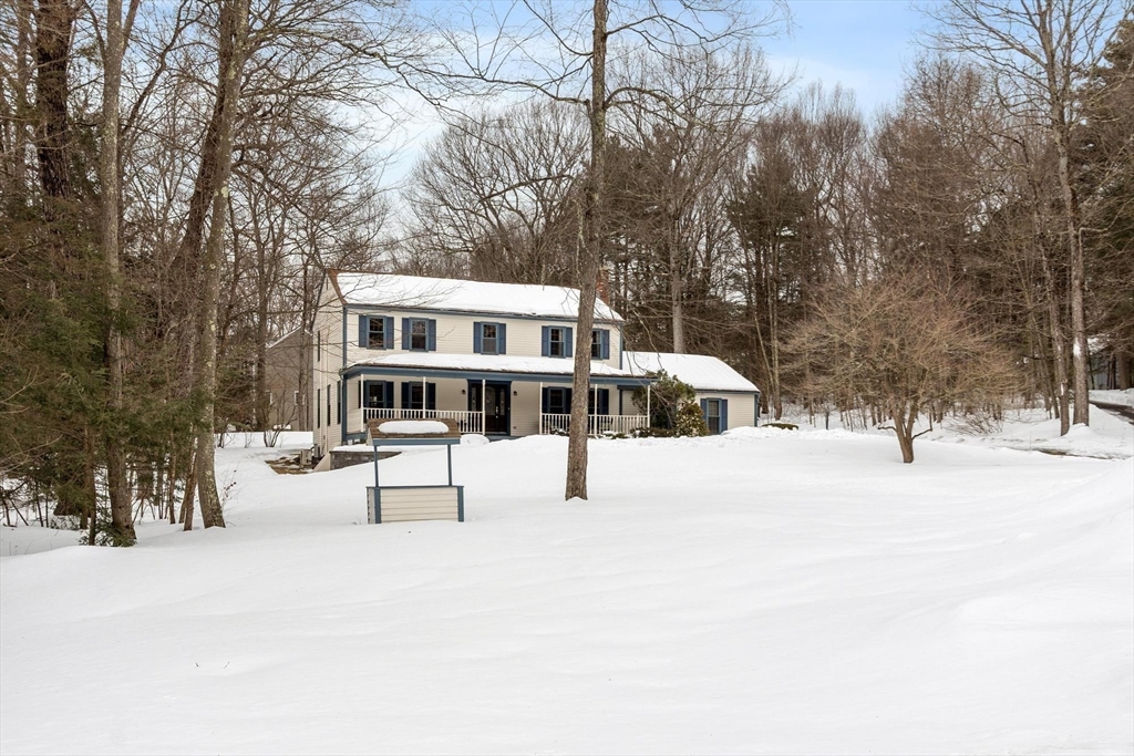 53 Throne Hill Road Groton, MA 01450 - Photo 27 of 38 a view of a building with snow on the road