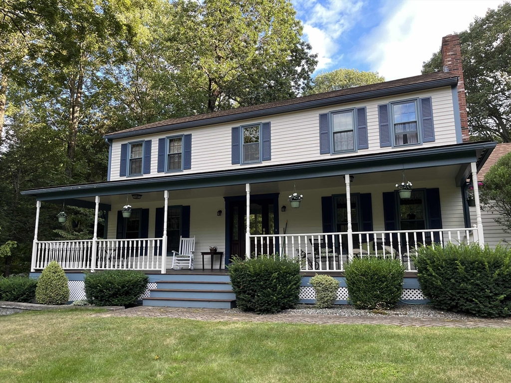 53 Throne Hill Road Groton, MA 01450 - Photo 3 of 38 a front view of a house with a yard