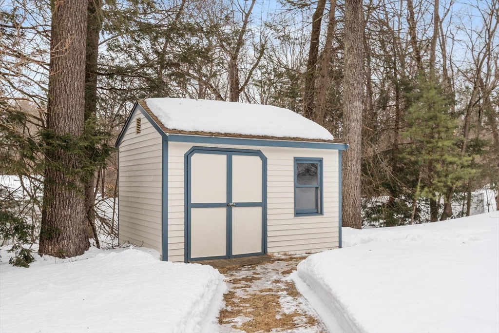53 Throne Hill Road Groton, MA 01450 - Photo 32 of 38 a view of a white house with a large tree