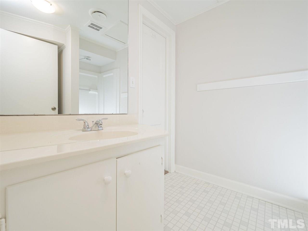 2804 Anderson Drive Raleigh, NC 27608 - Photo 11 of 23 a bathroom with a sink and a mirror