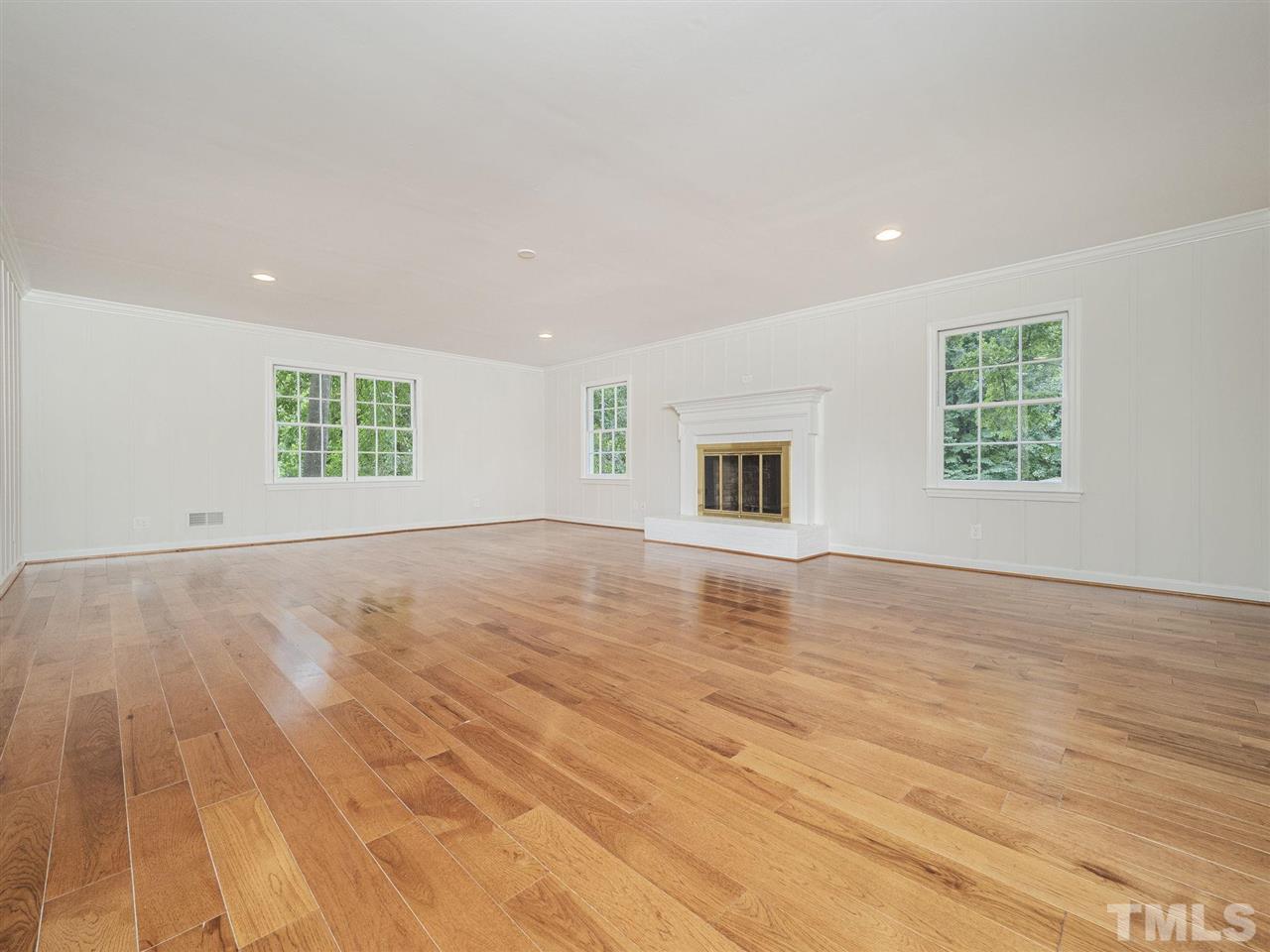 2804 Anderson Drive Raleigh, NC 27608 - Photo 13 of 23 a view of empty room with wooden floor and fan