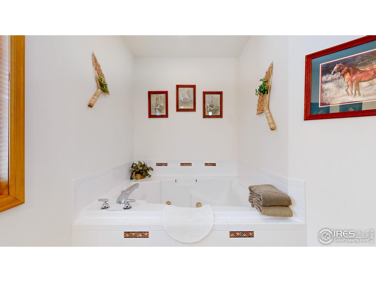 2120 Fall River Road, Unit 2 Estes Park, CO 80517 - Photo 15 of 39 a bathroom with a sink and a painting on the wall