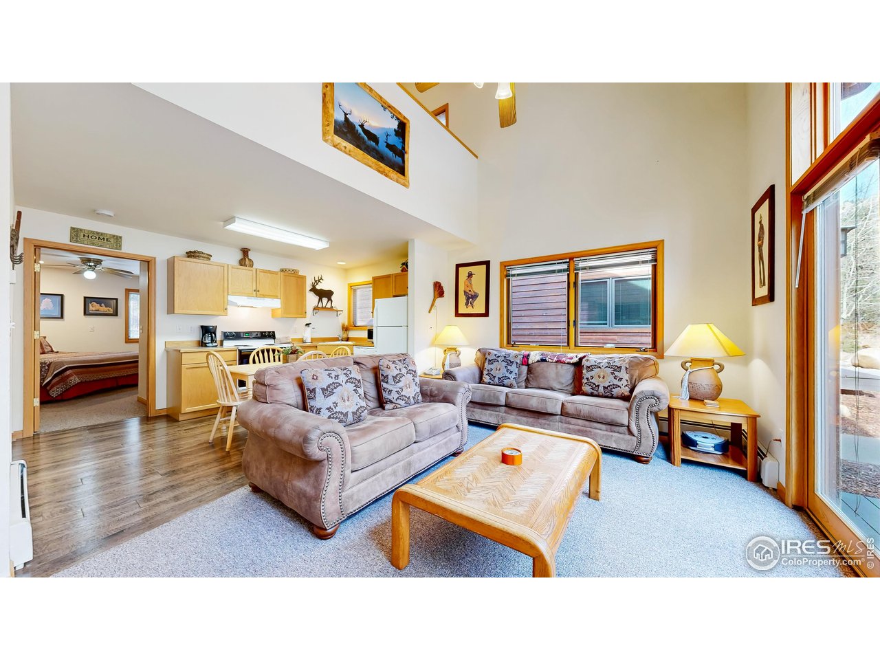 2120 Fall River Road, Unit 2 Estes Park, CO 80517 - Photo 6 of 39 a living room with furniture and a table