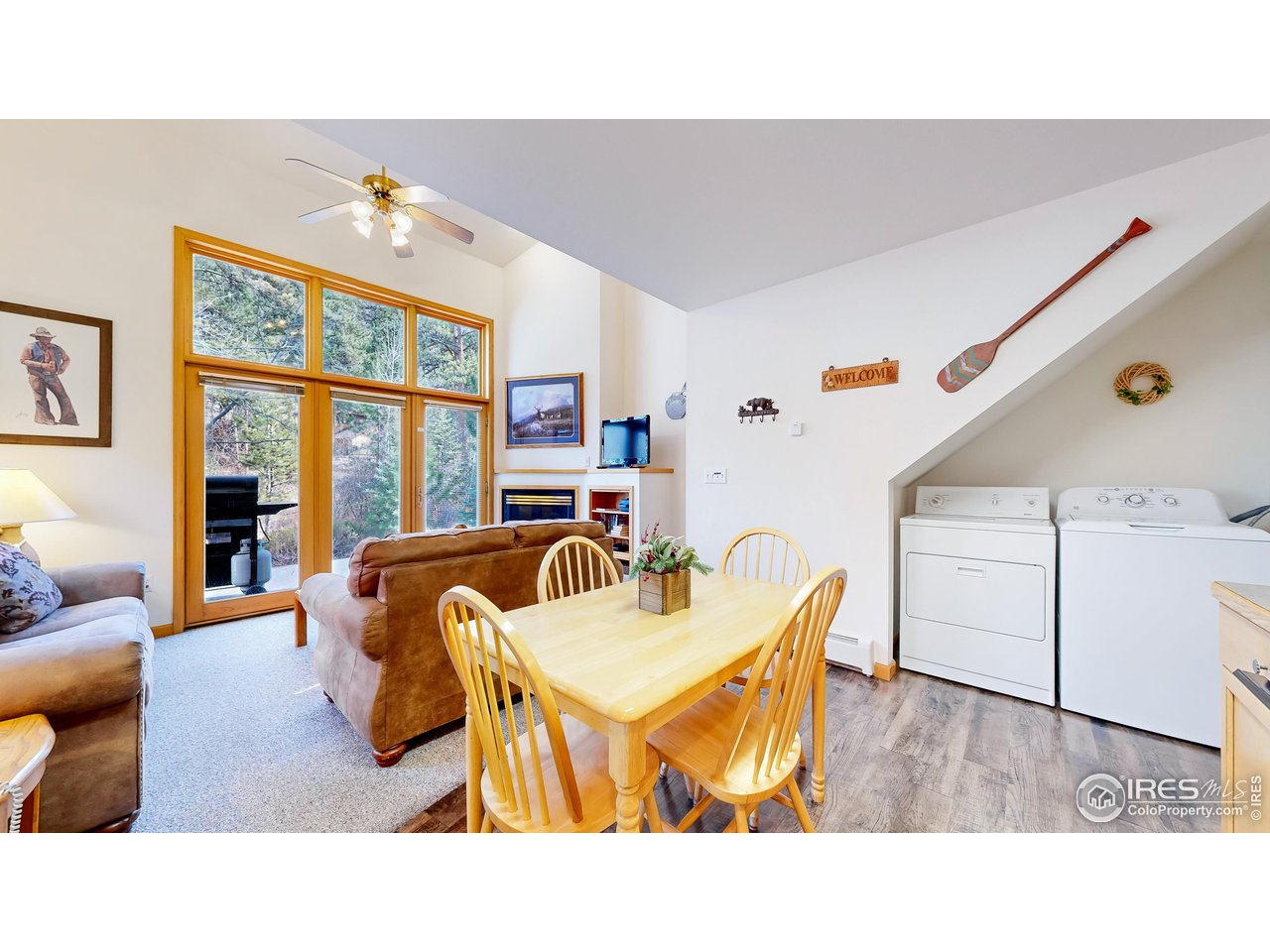 2120 Fall River Road, Unit 2 Estes Park, CO 80517 - Photo 10 of 39 a living room with furniture and a large window