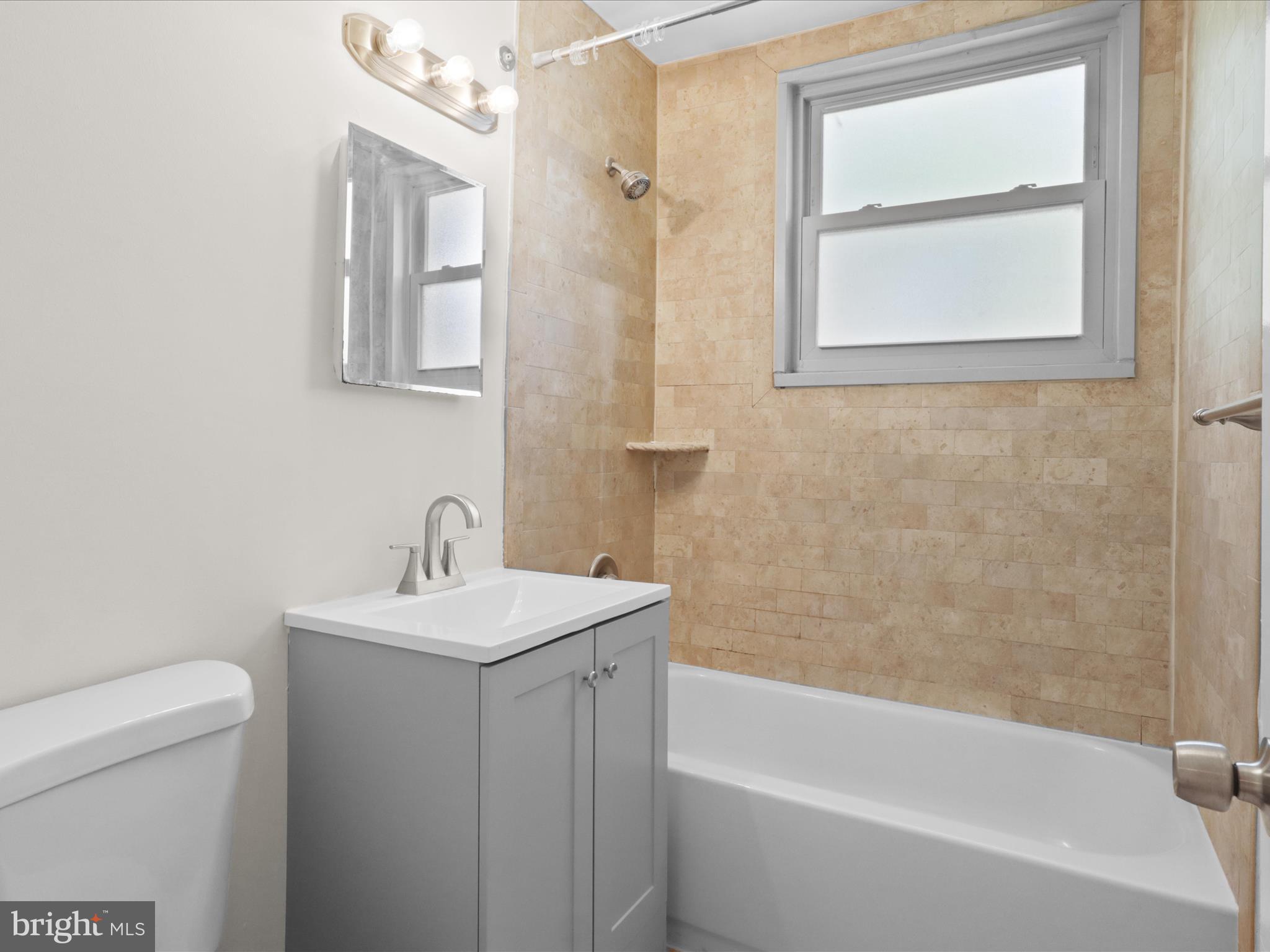 2850 Hartford Street Southeast, Unit 203 Washington, DC 20020 - Photo 11 of 23 Hall bath just outside the two bedrooms