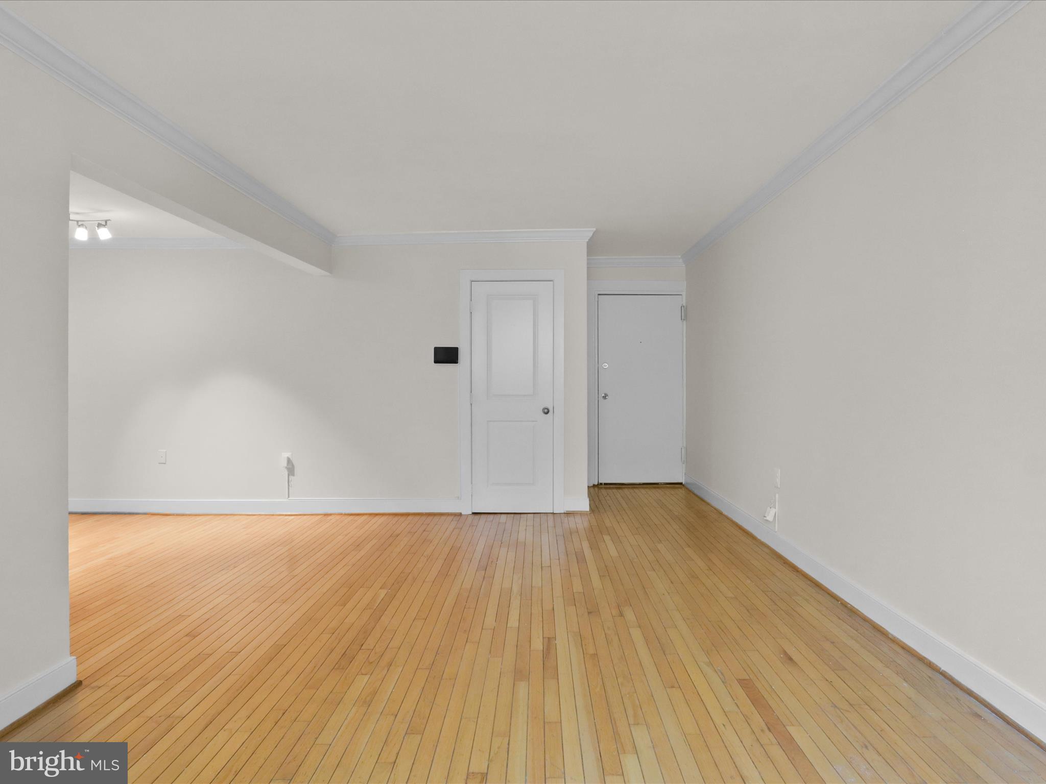 2850 Hartford Street Southeast, Unit 203 Washington, DC 20020 - Photo 4 of 23 Living room looking into dining room