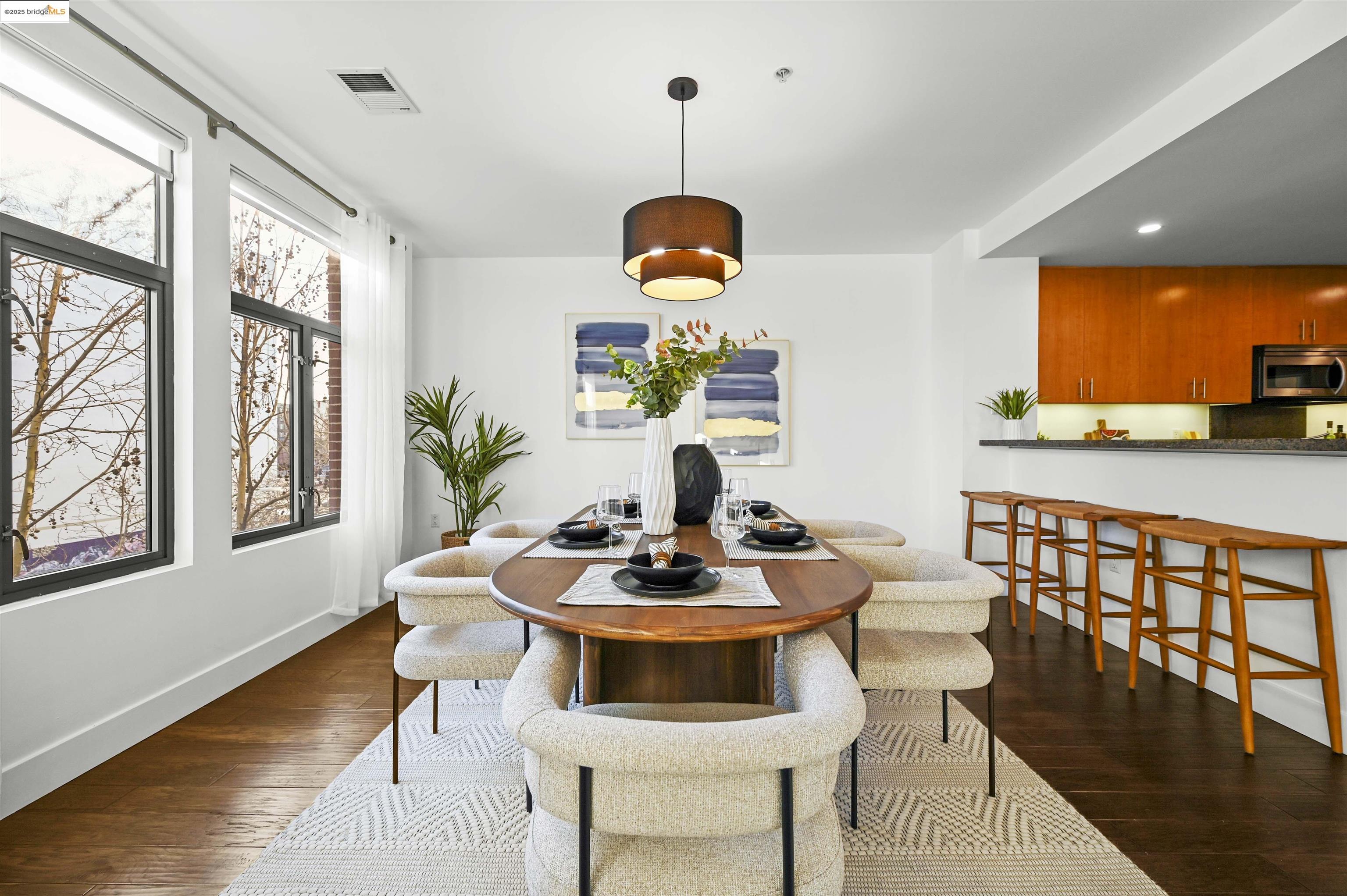 438 West Grand Avenue, Unit 422 Oakland, CA 94612 - Photo 11 of 52 Dining area with dark wood-style flooring and recessed lighting